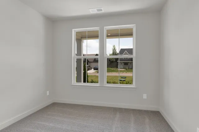 a spacious bathroom with a double vanity sink mirror and shower