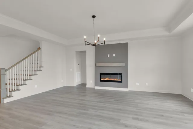a bedroom with a bed potted plant and a window