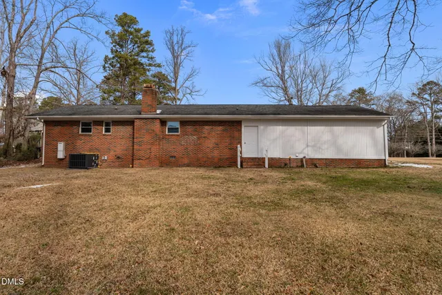 a view of backyard with large trees