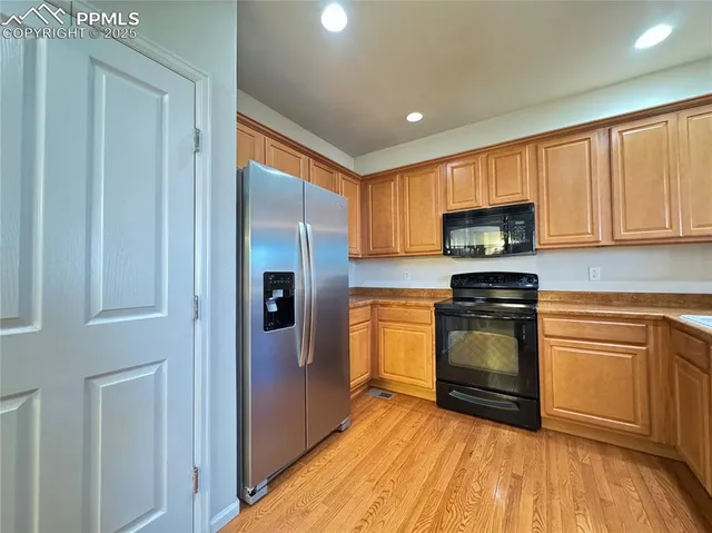 a kitchen with a stove and a sink