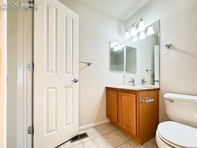 an empty room with a ceiling fan and a window
