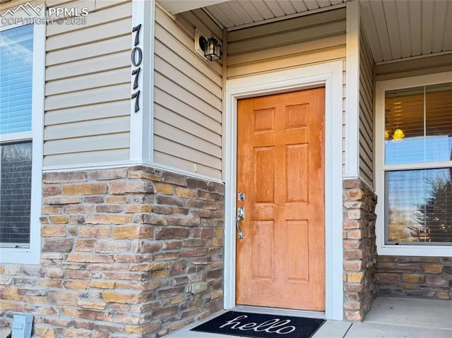 a view of a door and a window
