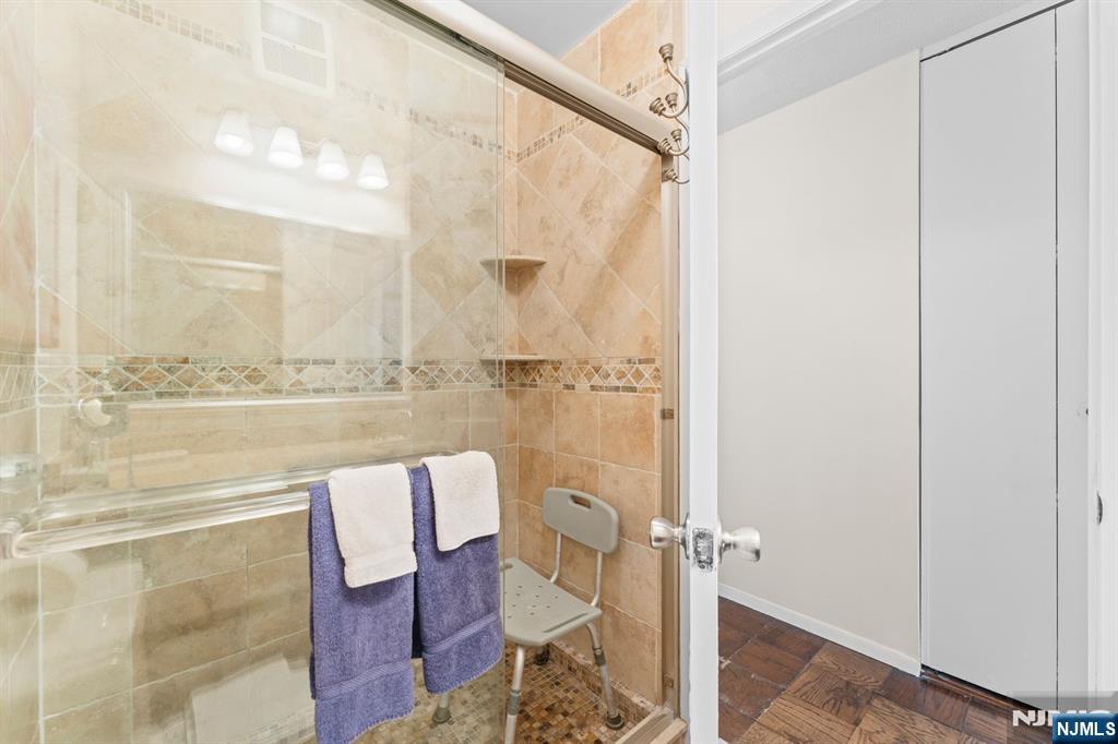 250 Gorge Road, Unit 14J Cliffside Park, NJ 07010 - Photo 13 of 45 a bathroom with a shower and a sink