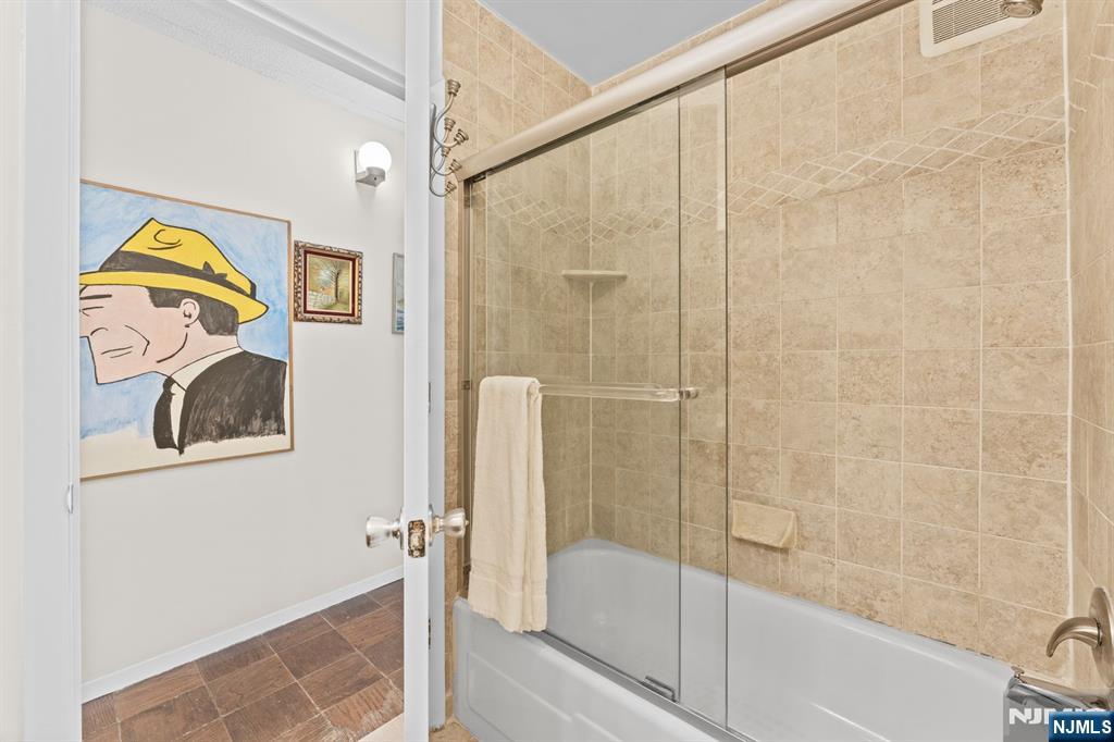 250 Gorge Road, Unit 14J Cliffside Park, NJ 07010 - Photo 18 of 45 a bathroom with a bathtub and a shower