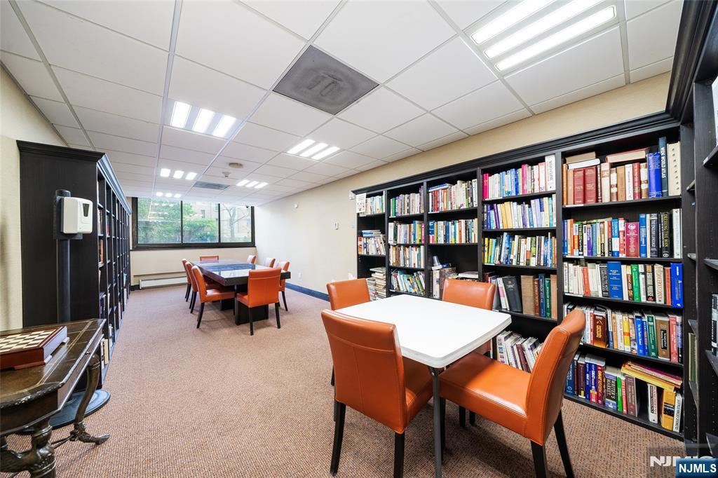 250 Gorge Road, Unit 14J Cliffside Park, NJ 07010 - Photo 29 of 45 a outdoor space with furniture a rug and a book shelf
