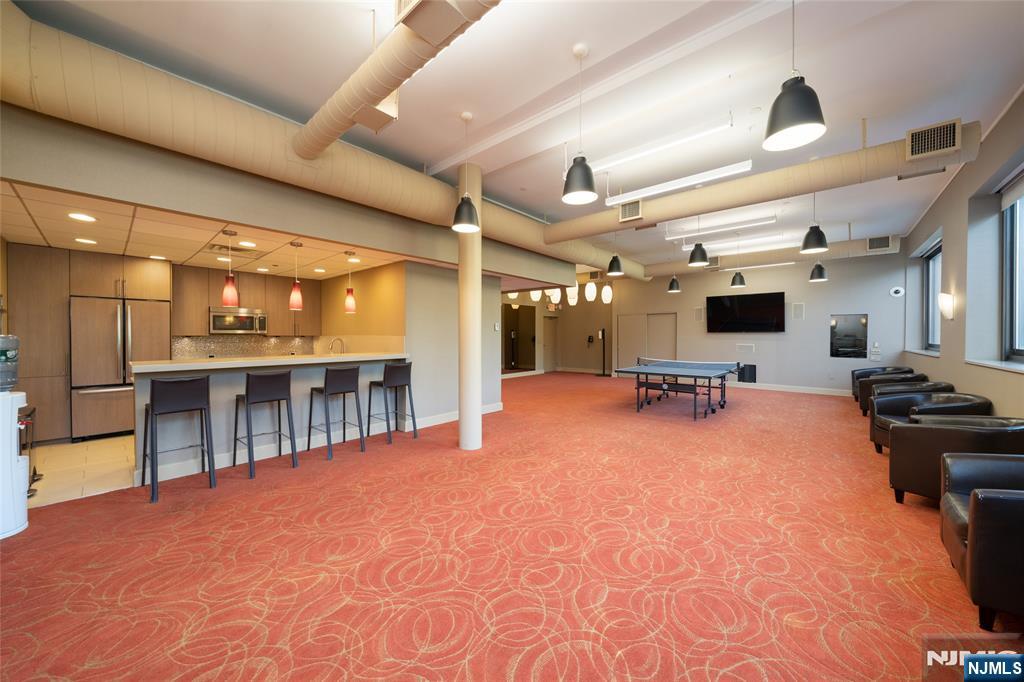 250 Gorge Road, Unit 14J Cliffside Park, NJ 07010 - Photo 32 of 45 a large room with gym equipment