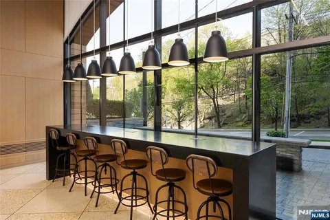 a kitchen with a sink stainless steel appliances and cabinets