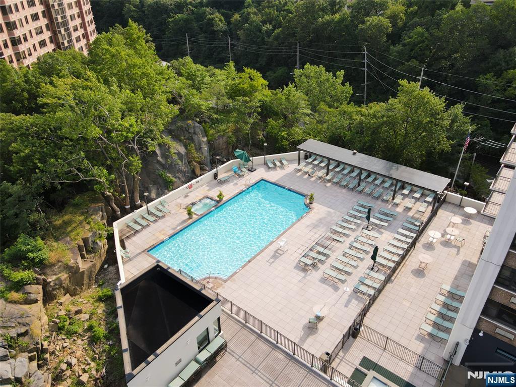 250 Gorge Road, Unit 14J Cliffside Park, NJ 07010 - Photo 44 of 45 a view of a tennis ground with a small pool