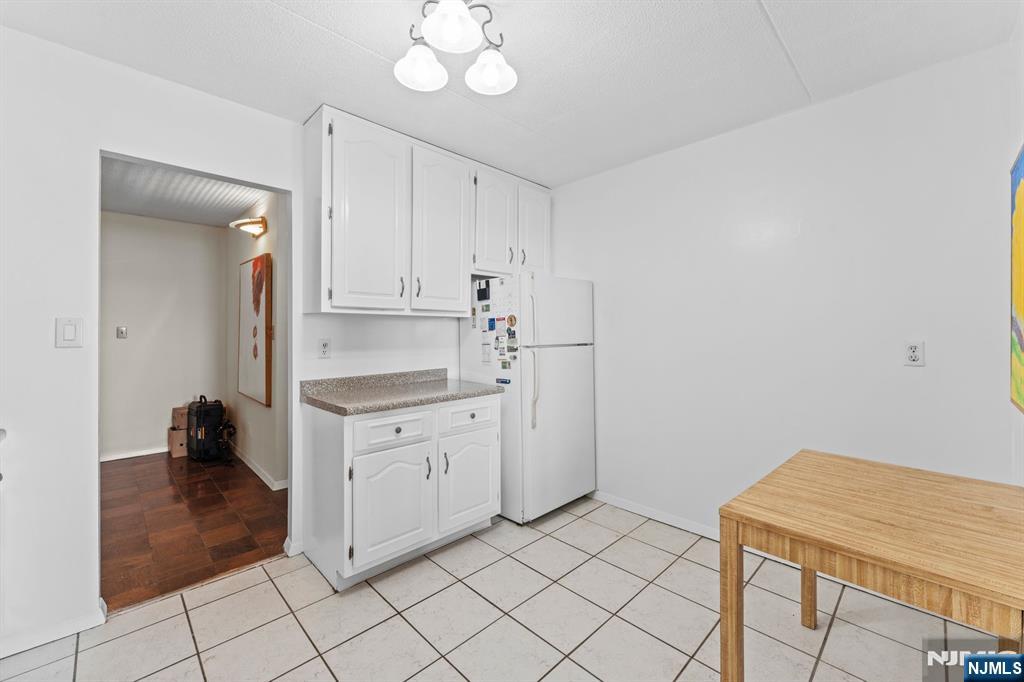 250 Gorge Road, Unit 14J Cliffside Park, NJ 07010 - Photo 8 of 45 a kitchen with white cabinets and sink