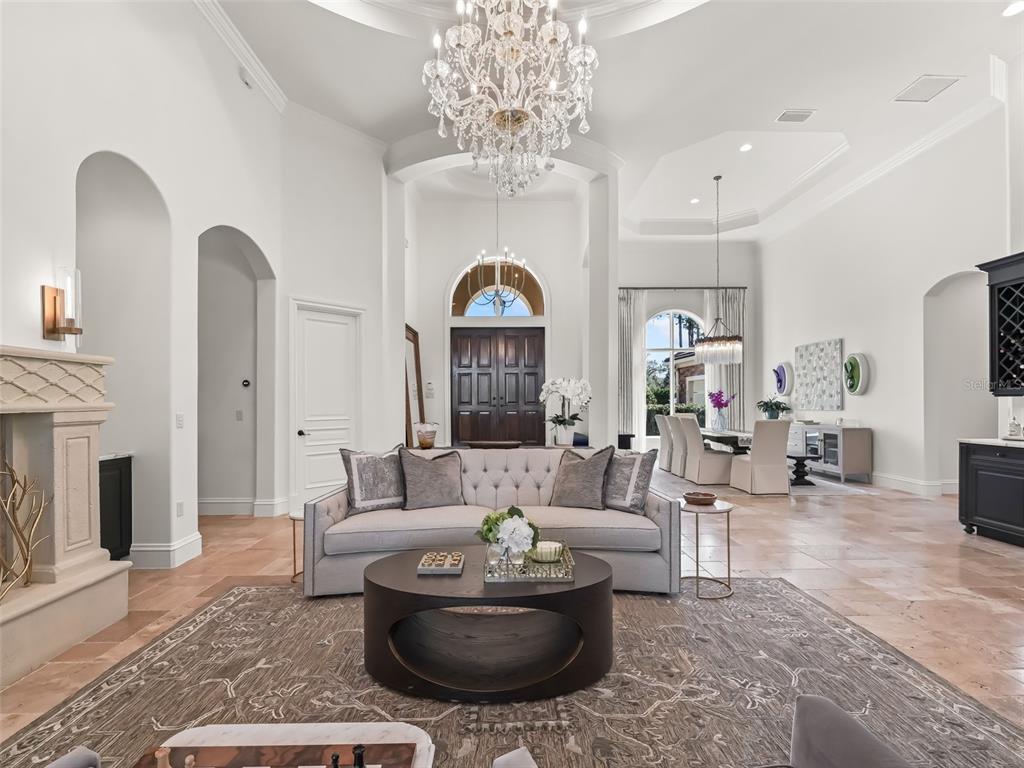 3848 Northwest 85th Terrace Ocala, FL 34482 - Photo 14 of 62 a living room with furniture and a chandelier