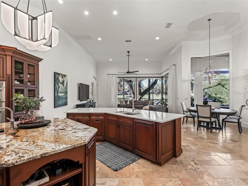 3848 Northwest 85th Terrace Ocala, FL 34482 - Photo 17 of 62 a kitchen with kitchen island granite countertop lots of counter top space