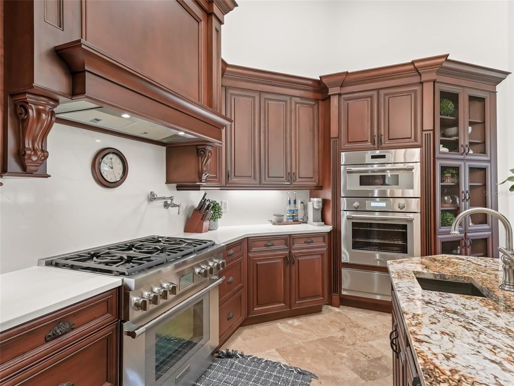 3848 Northwest 85th Terrace Ocala, FL 34482 - Photo 19 of 62 a kitchen with stainless steel appliances granite countertop a stove and a sink