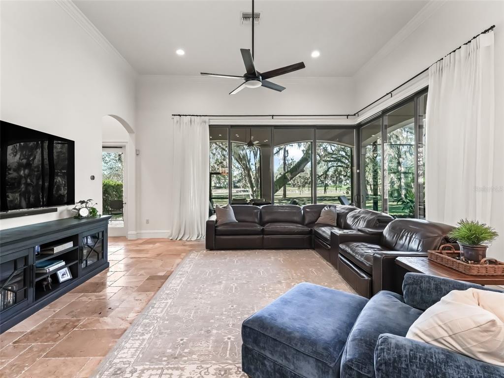 3848 Northwest 85th Terrace Ocala, FL 34482 - Photo 24 of 62 a living room with furniture and a flat screen tv