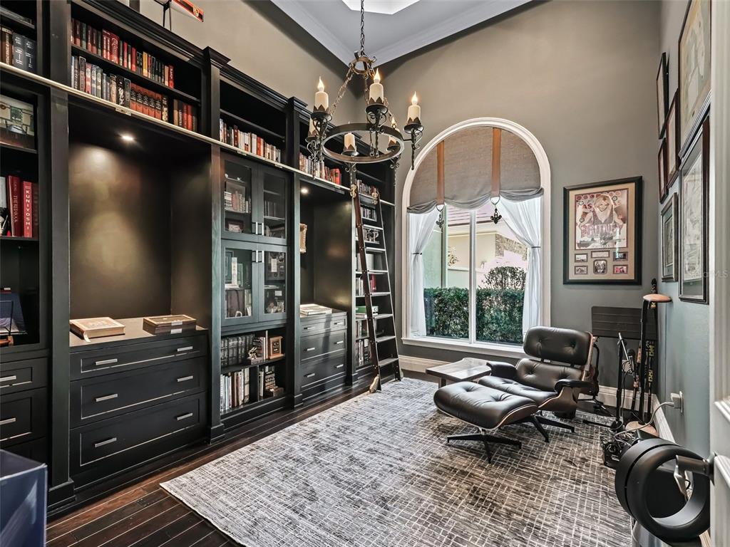 3848 Northwest 85th Terrace Ocala, FL 34482 - Photo 25 of 62 a living room with furniture a rug and a flat screen tv