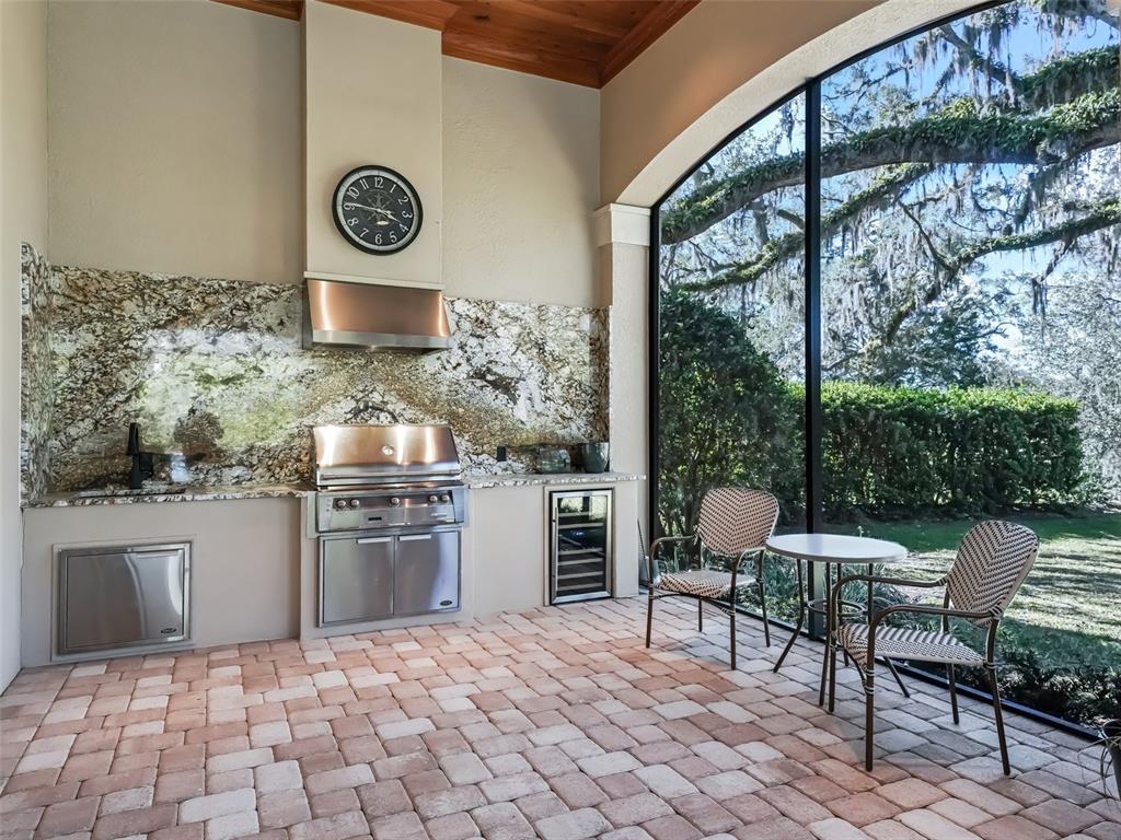 3848 Northwest 85th Terrace Ocala, FL 34482 - Photo 36 of 62 a kitchen with a stove and a chair