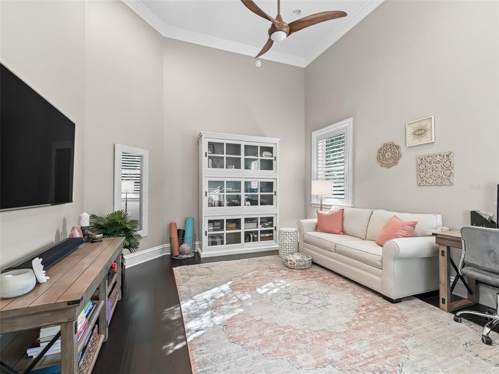 3848 Northwest 85th Terrace Ocala, FL 34482 - Photo 43 of 62 a living room with furniture a flat screen tv and a window