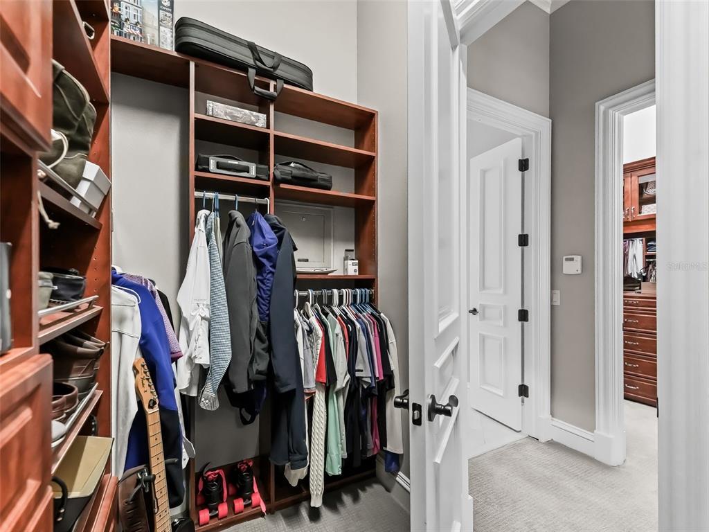 3848 Northwest 85th Terrace Ocala, FL 34482 - Photo 54 of 62 a view of walk in closet with clothes and shoes
