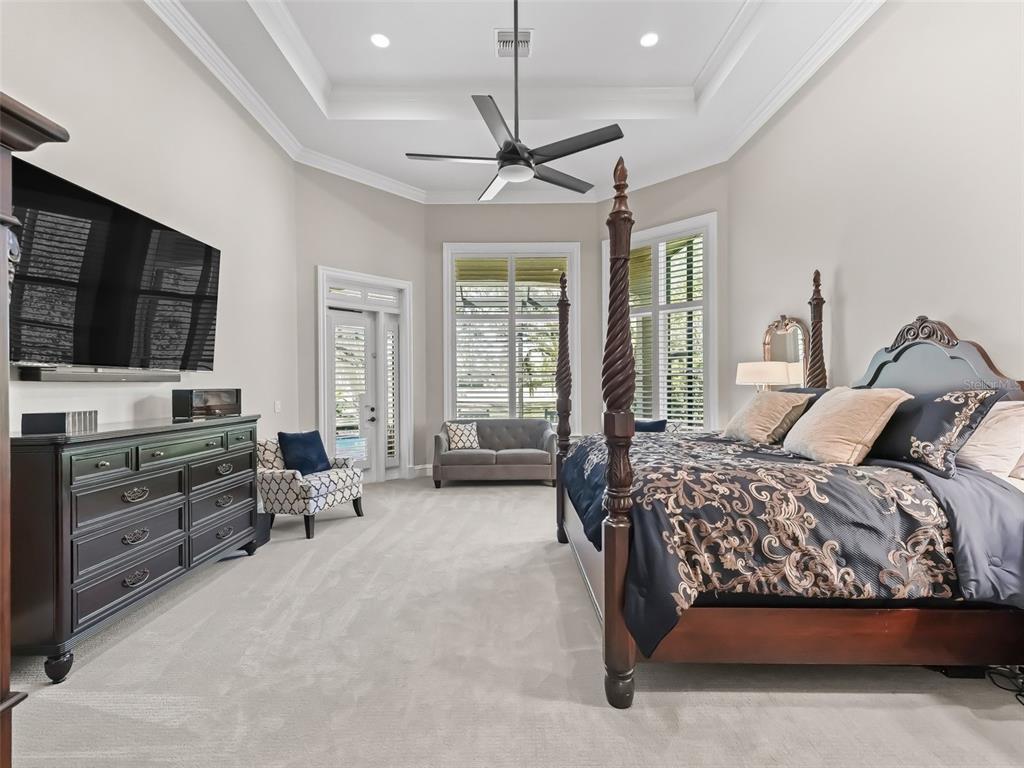 3848 Northwest 85th Terrace Ocala, FL 34482 - Photo 55 of 62 a bedroom with a bed and a flat screen tv
