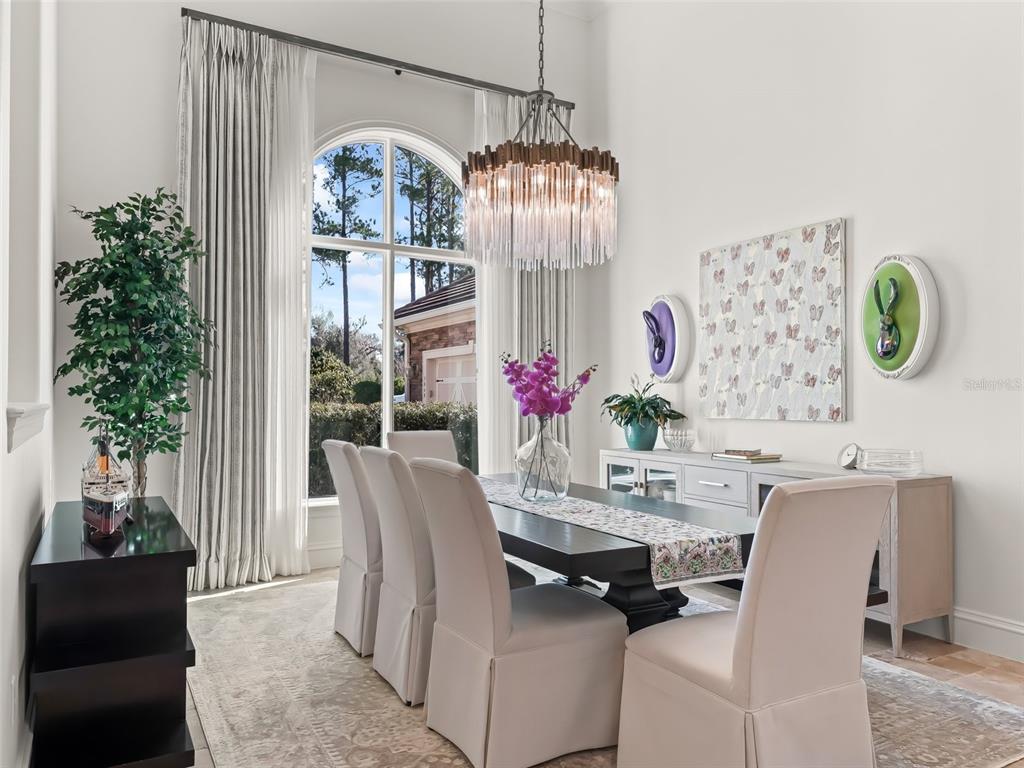 3848 Northwest 85th Terrace Ocala, FL 34482 - Photo 10 of 62 a dining room with furniture a chandelier and window