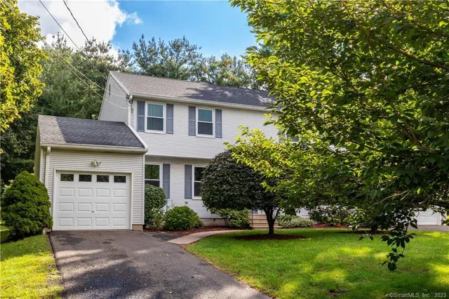 a aerial view of a house with a yard