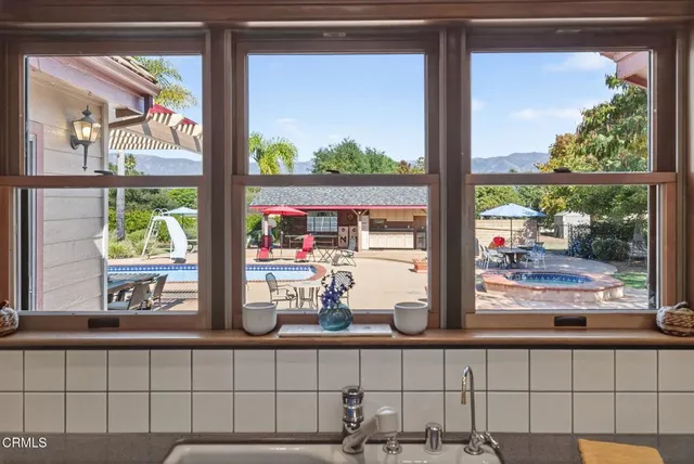 a view of a dining room with furniture window and outside view