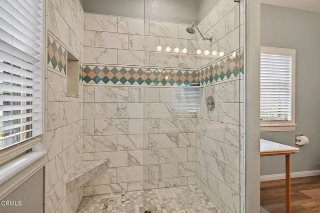 a swimming pool with outdoor seating and yard