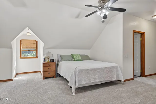 a view of a room with furniture and window