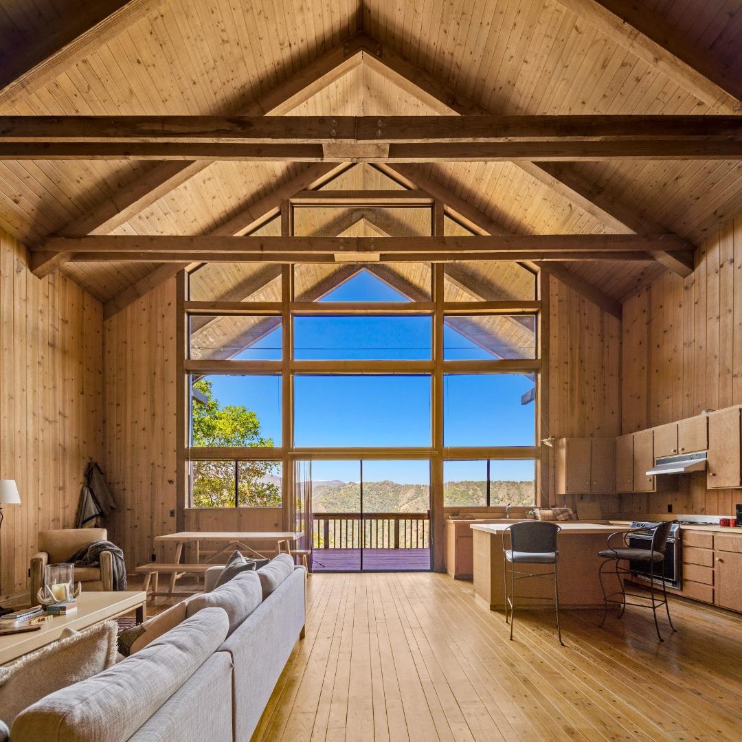 38225 Nason Road Carmel Valley, CA 93924 - Photo 11 of 29 a living room with furniture a ceiling fan and a wooden floor