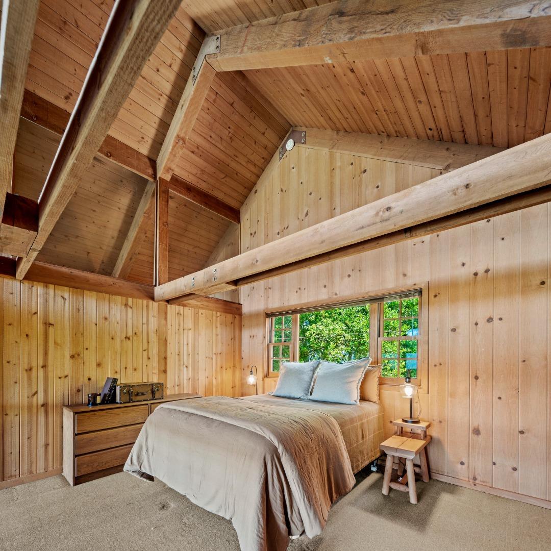 38225 Nason Road Carmel Valley, CA 93924 - Photo 14 of 29 a bed room with a bed and a large window