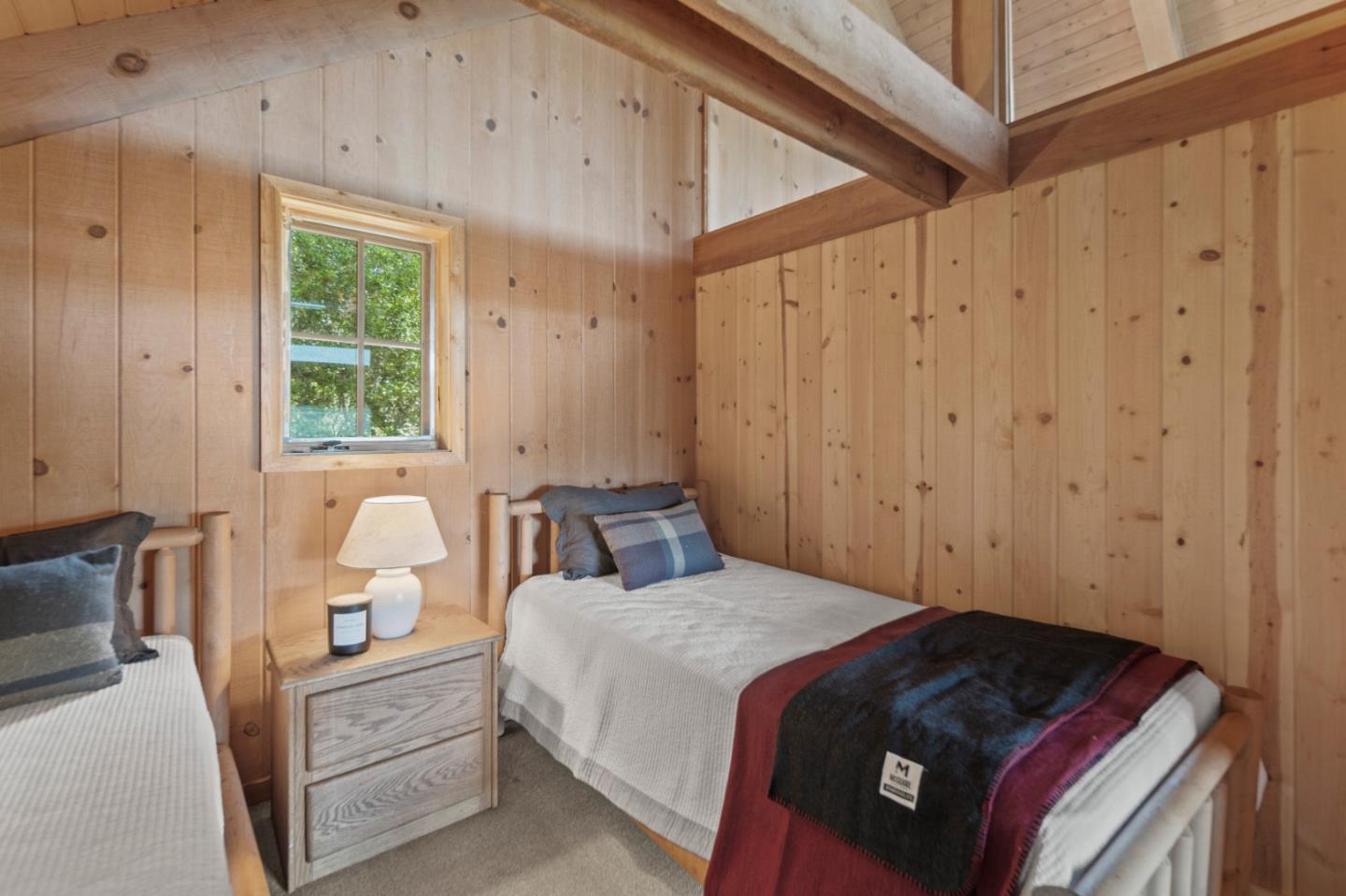 38225 Nason Road Carmel Valley, CA 93924 - Photo 17 of 29 a bedroom with a bed and a window