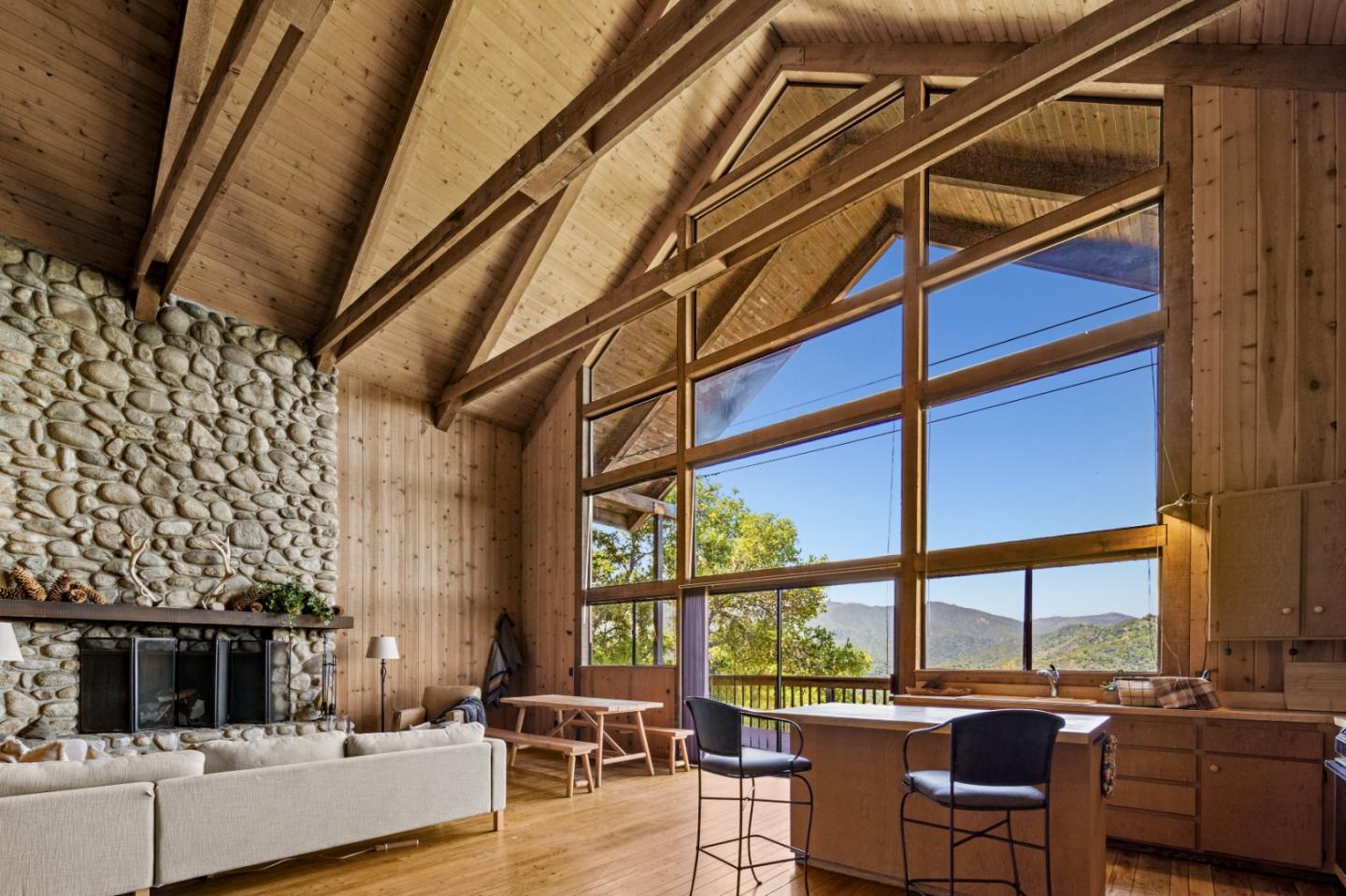 38225 Nason Road Carmel Valley, CA 93924 - Photo 5 of 29 a living room with furniture and a floor to ceiling window