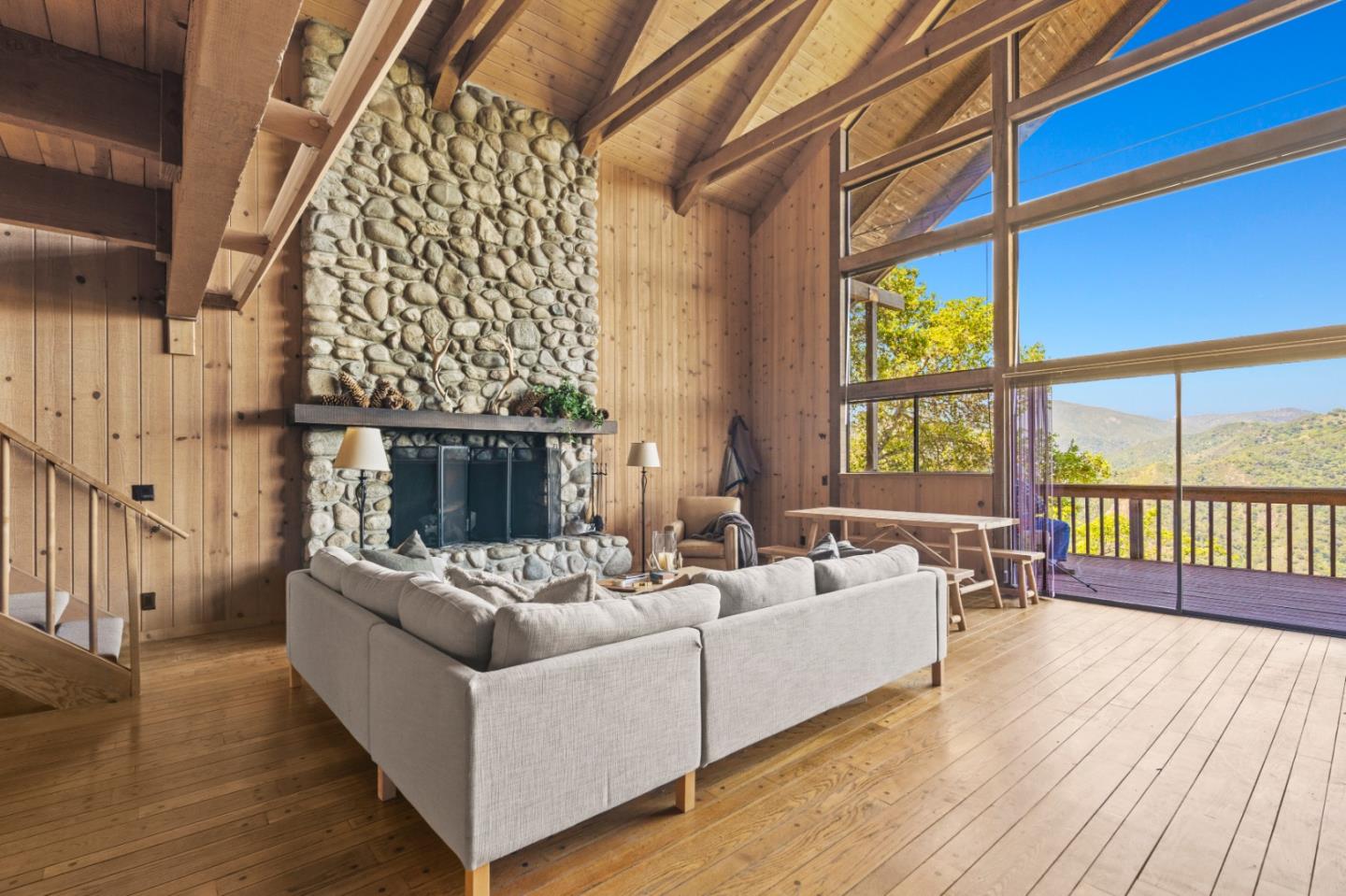 38225 Nason Road Carmel Valley, CA 93924 - Photo 7 of 29 a living room with furniture and a floor to ceiling window