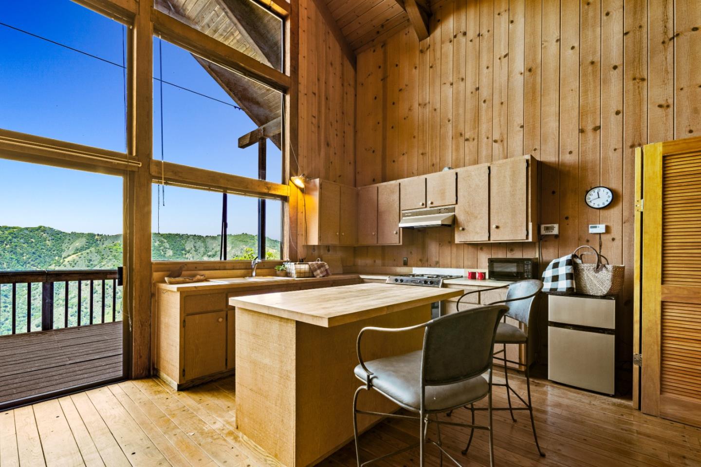 38225 Nason Road Carmel Valley, CA 93924 - Photo 8 of 29 a kitchen with stainless steel appliances a stove a sink and cabinets