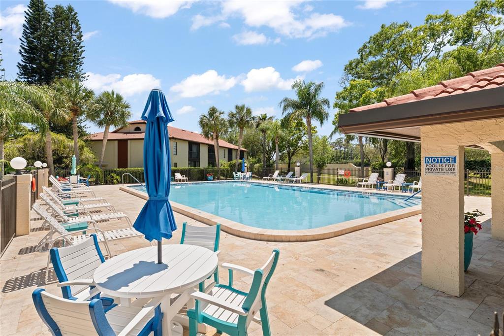 1801 East Lake Road South, Unit 4E Palm Harbor, FL 34685 - Photo 26 of 26 a view of a swimming pool with a patio