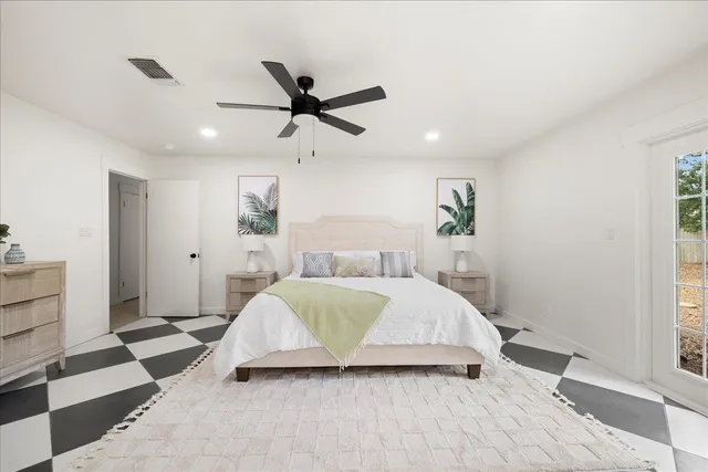 a bedroom with a bed and a window