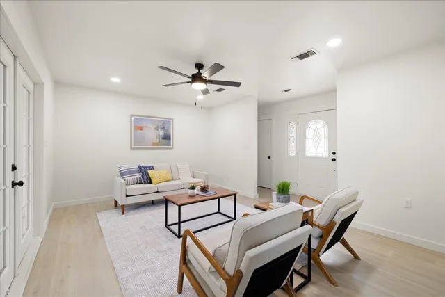 a view of a livingroom with furniture and wooden floor