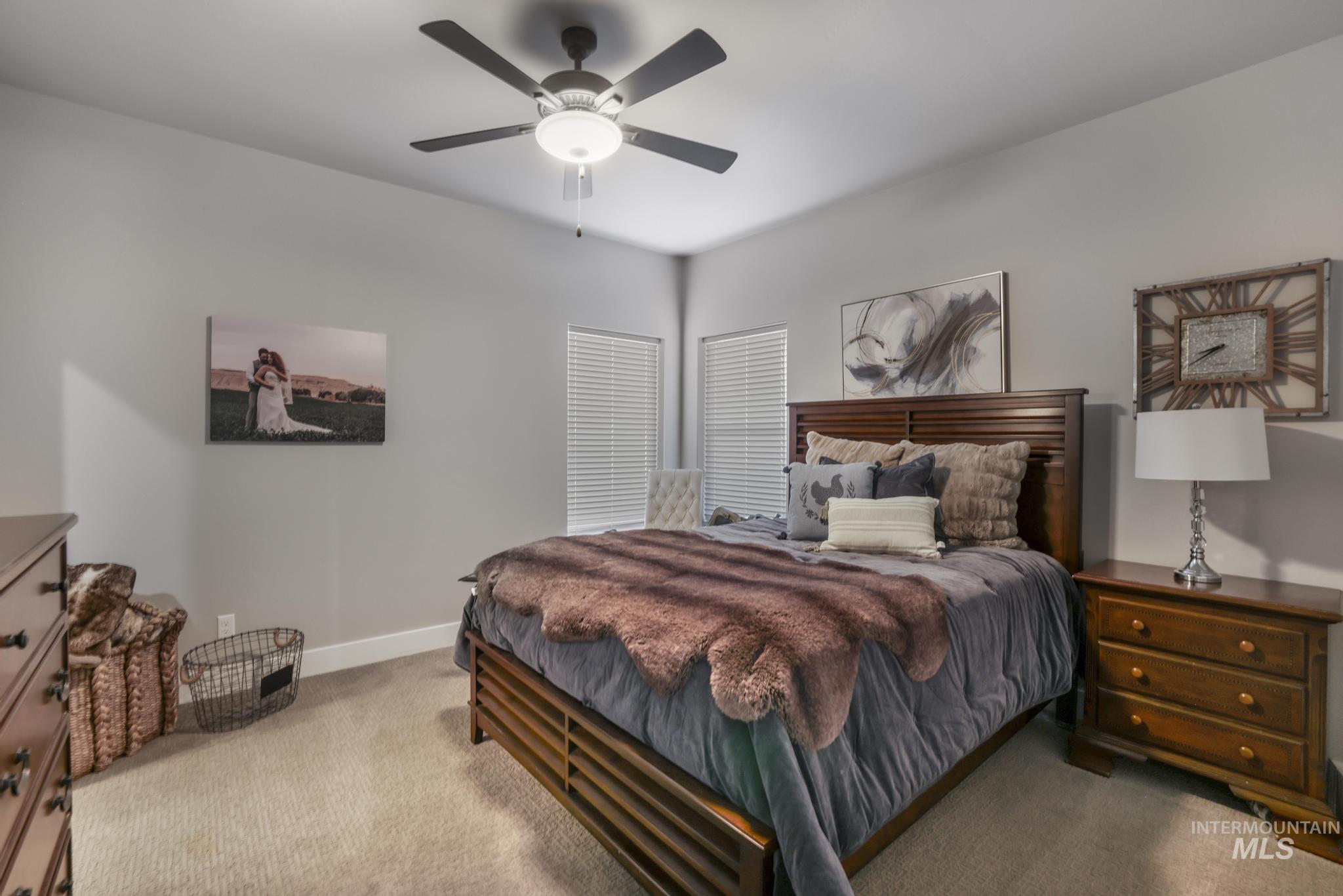 439 Meadowview Lane Twin Falls, ID 83301 - Photo 20 of 48 Bedroom featuring carpet flooring and a ceiling fan