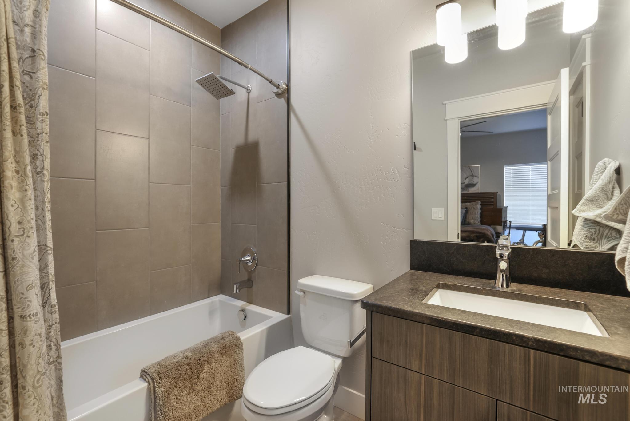 439 Meadowview Lane Twin Falls, ID 83301 - Photo 22 of 48 Ensuite bathroom featuring vanity and shower / bath combination with curtain