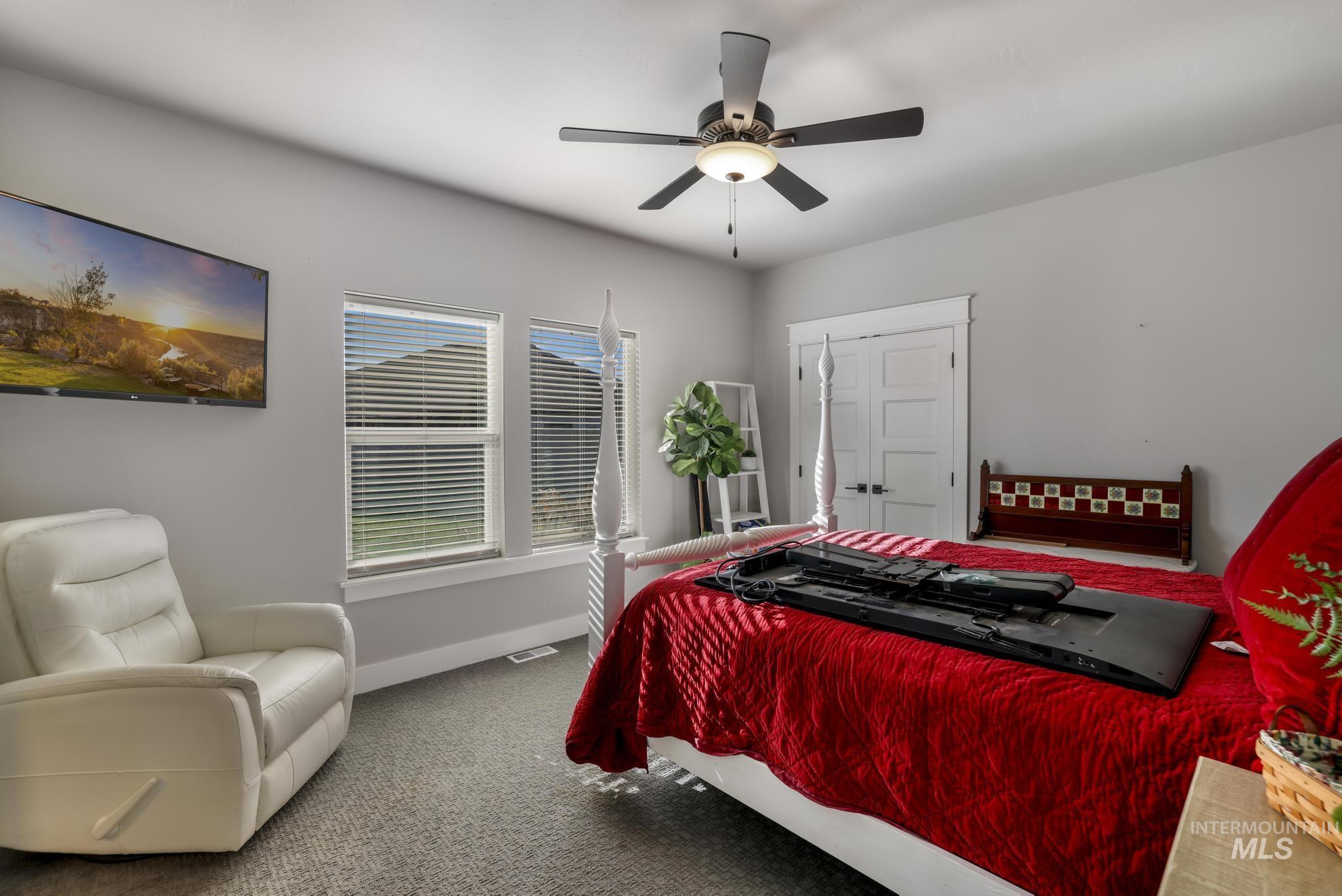 439 Meadowview Lane Twin Falls, ID 83301 - Photo 23 of 48 Bedroom with carpet flooring and a ceiling fan