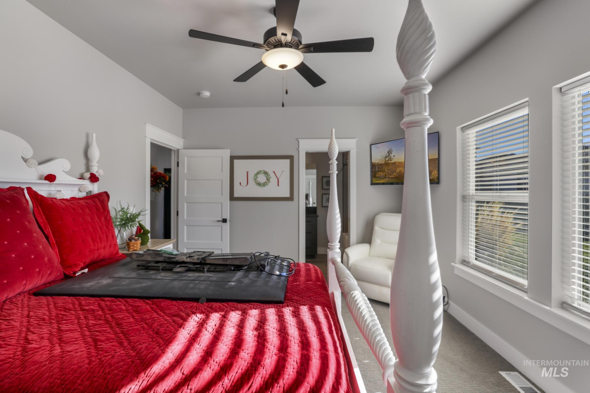 439 Meadowview Lane Twin Falls, ID 83301 - Photo 24 of 48 Carpeted bedroom featuring ceiling fan and baseboards