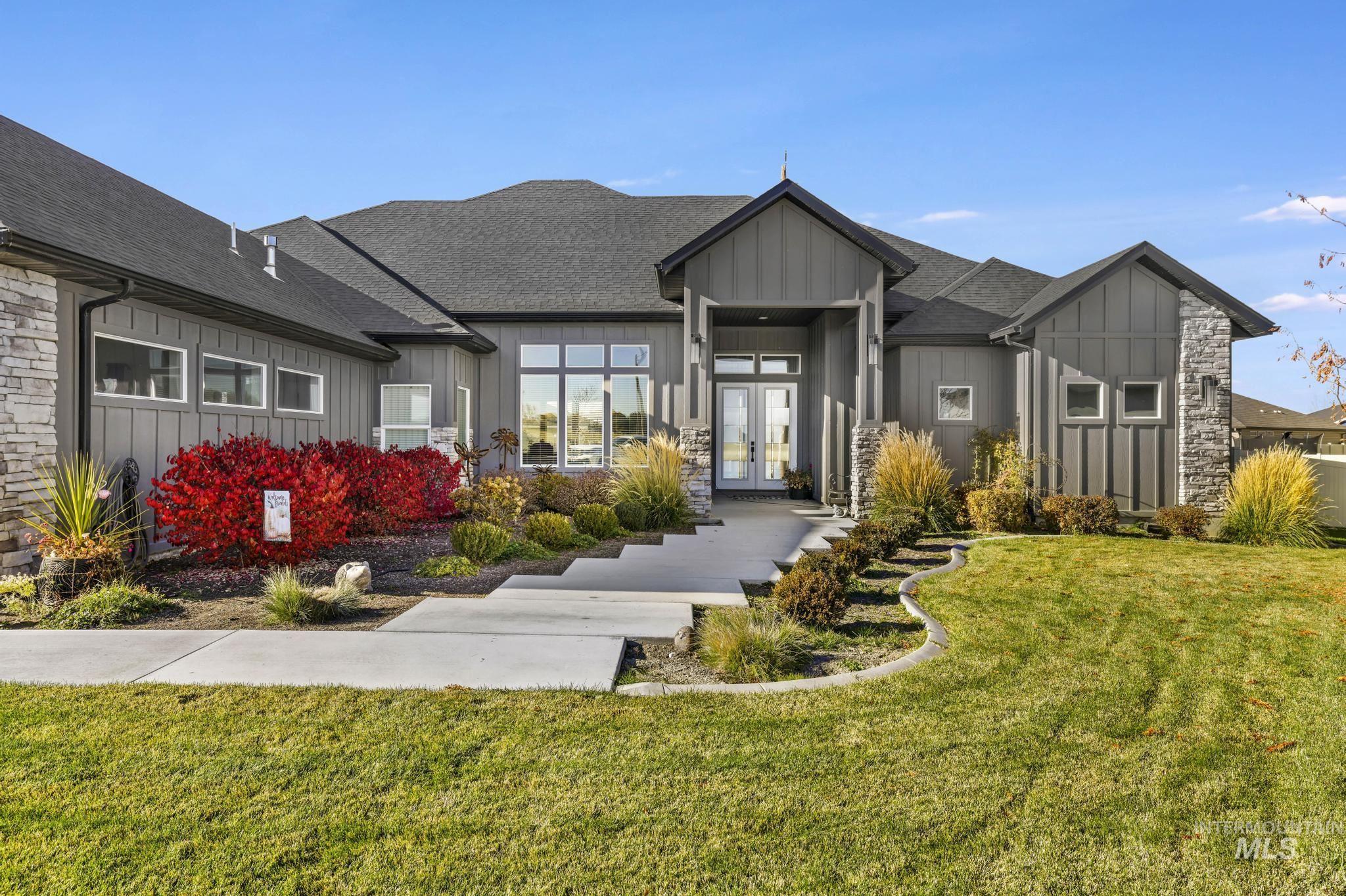 439 Meadowview Lane Twin Falls, ID 83301 - Photo 3 of 48 Modern farmhouse featuring board and batten siding, french doors, a front lawn, roof with shingles, and stone siding