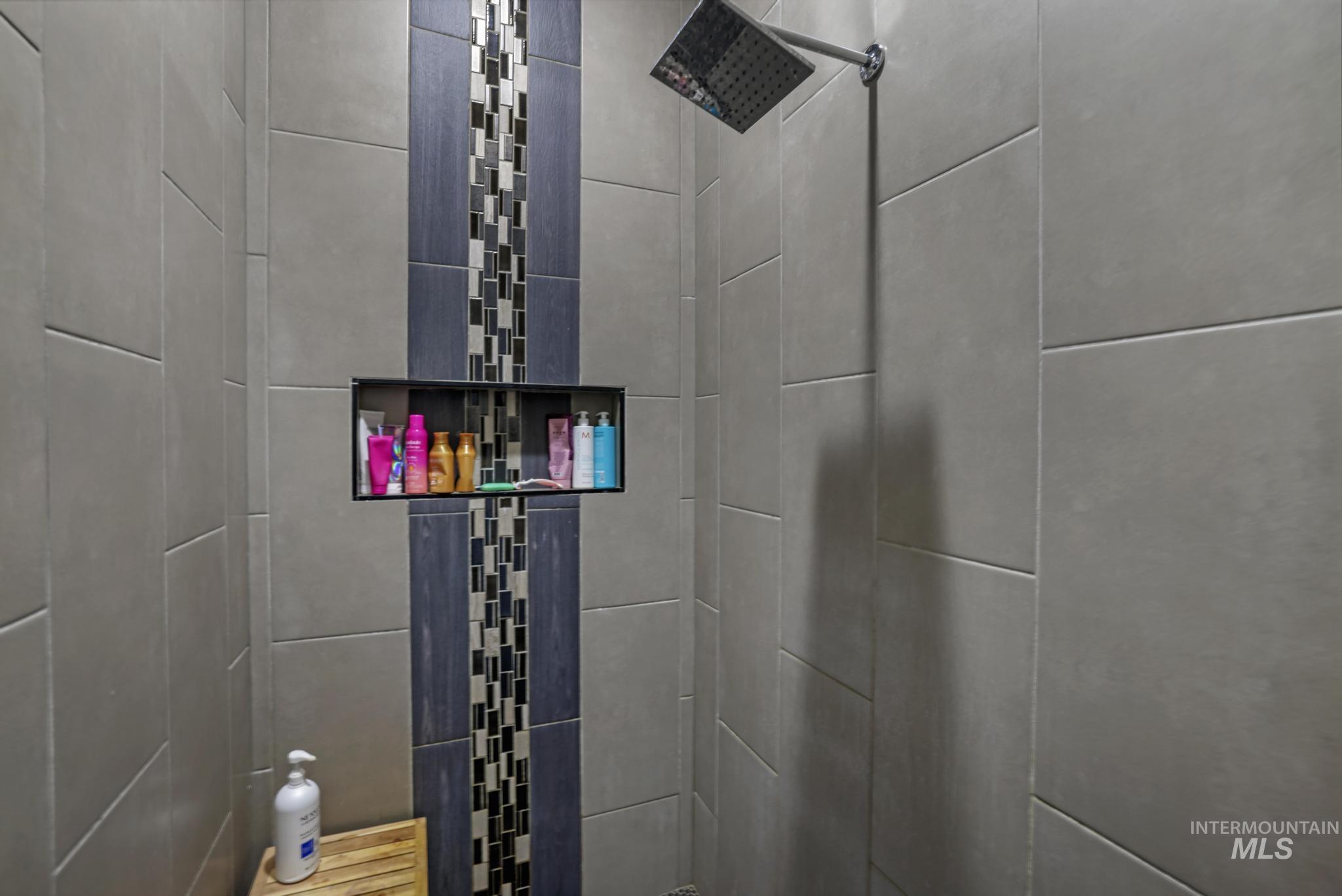 439 Meadowview Lane Twin Falls, ID 83301 - Photo 34 of 48 Bathroom view of tiled shower and a package area