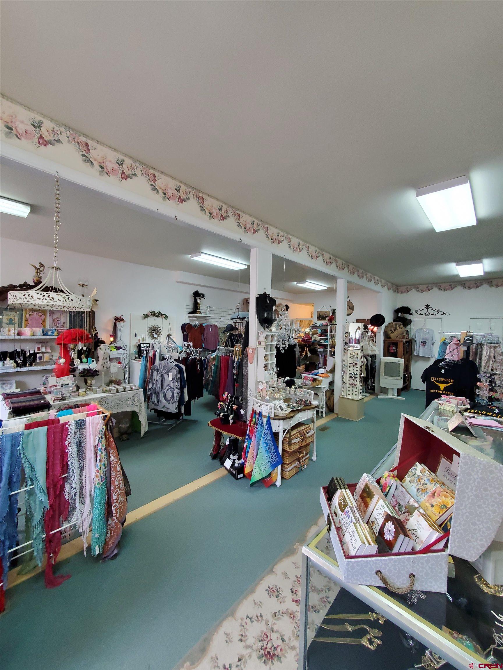 1145 Greene Street Silverton, CO 81433 - Photo 12 of 15 a bed room with furniture and a flat screen tv
