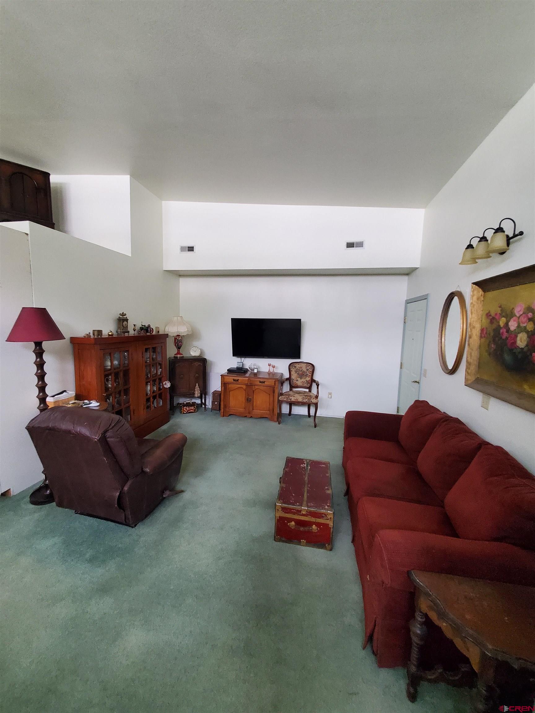 1145 Greene Street Silverton, CO 81433 - Photo 2 of 15 a living room with furniture and a flat screen tv