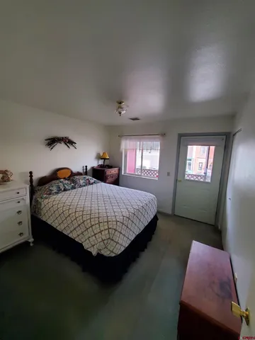 a bed room with a bed and a window