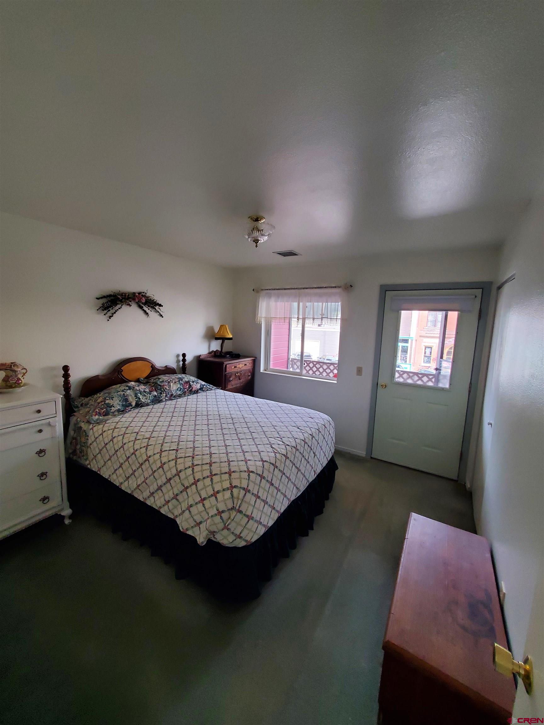 1145 Greene Street Silverton, CO 81433 - Photo 3 of 15 a bed room with a bed and a window