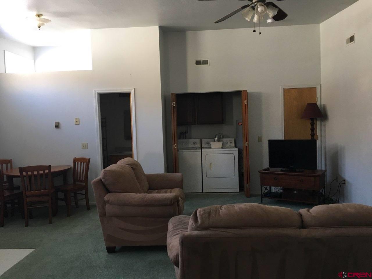 1145 Greene Street Silverton, CO 81433 - Photo 8 of 15 a living room with furniture and a flat screen tv