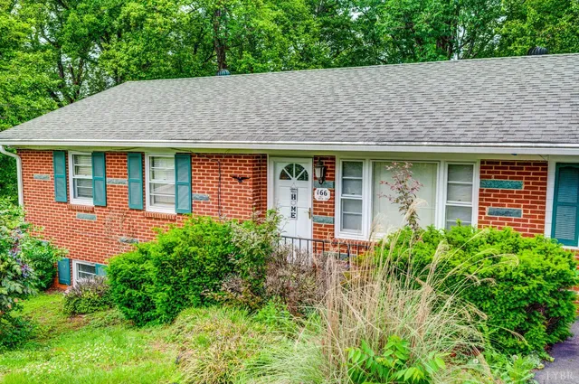 front view of a house with potted plants