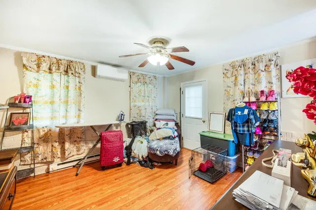 a porch with a bench next to a yard