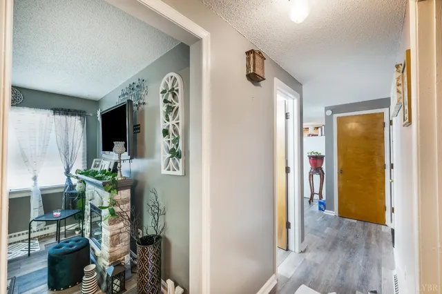 a outdoor dining space with furniture a rug and a chandelier